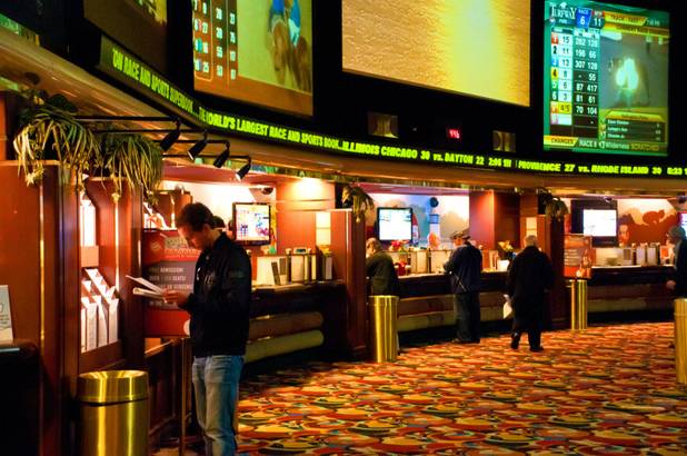 Crowds start to gather at The Las Vegas Hilton's sports book two days before the start of the NBA season, Friday Dec. 23, 2011.